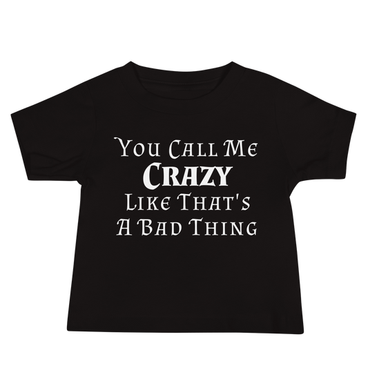 "You Call Me Crazy Like That's A Bad Thing" printed on a black baby jersey short sleeve tee laying on a flat surface