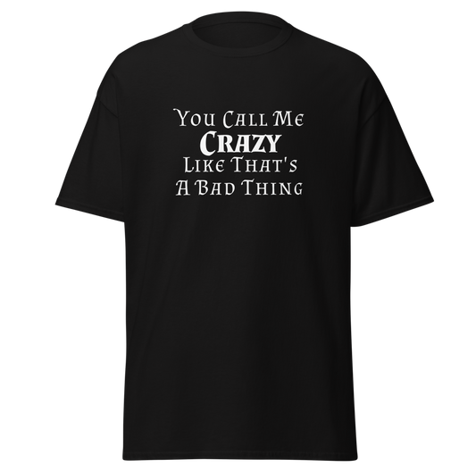 "You Call Me Crazy Like That's A Bad Thing" printed on a black unisex classic tee laying on a flat surface