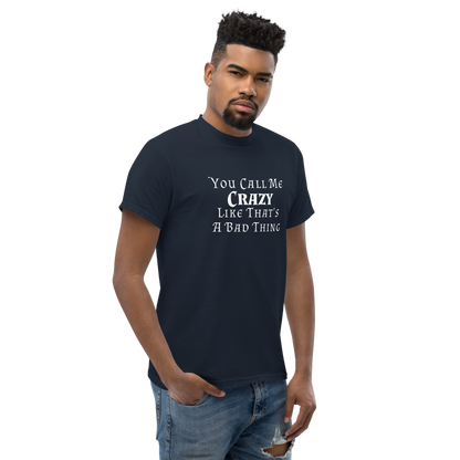 "You Call Me Crazy Like That's A Bad Thing" printed on a navy unisex classic tee worn by a male