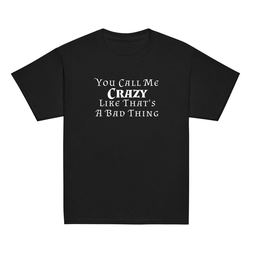 "You Call Me Crazy Like That's A Bad Thing" printed on a black youth classic tee laying on a flat surface
