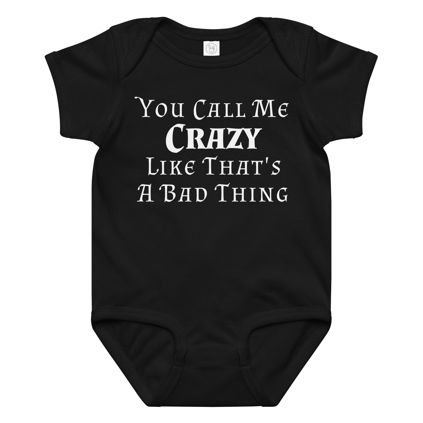 "You Call Me Crazy Like That's A Bad Thing" printed on a black baby jersey bodysuit laying on a flat surface amongst other clothes