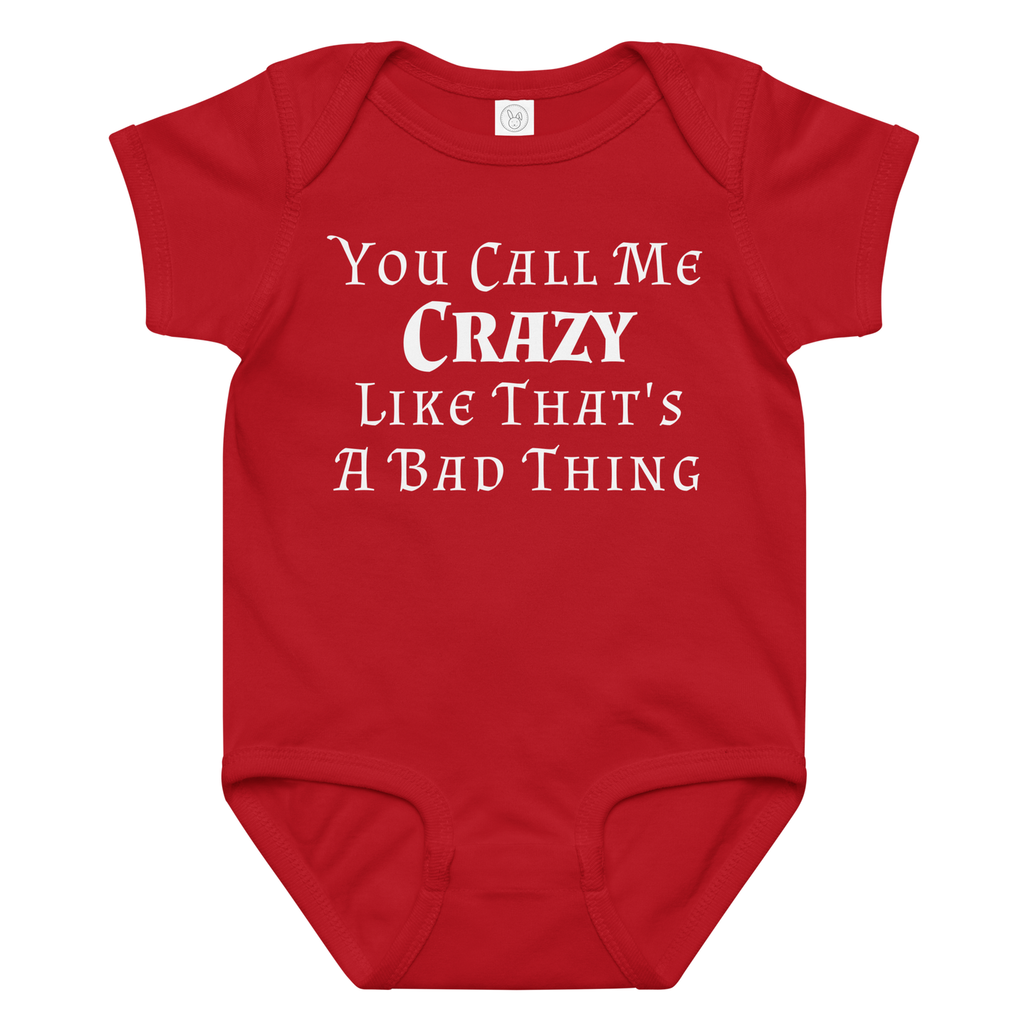 "You Call Me Crazy Like That's A Bad Thing" printed on a red baby jersey bodysuit laying on a flat surface amongst other clothes