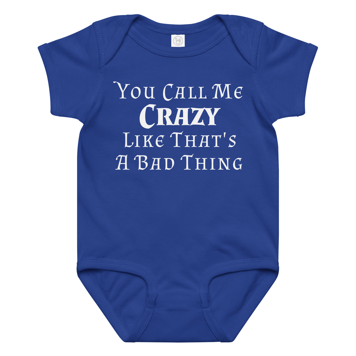 "You Call Me Crazy Like That's A Bad Thing" printed on a royal baby jersey bodysuit laying on a flat surface amongst other clothes