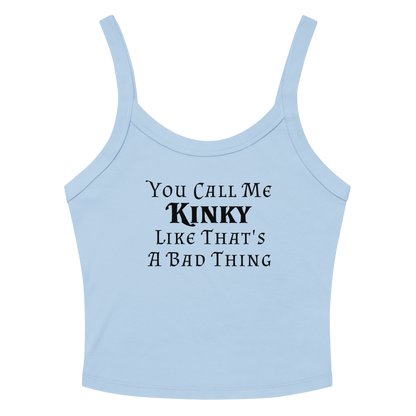 "You Call Me Kinky Like That's A Bad Thing" printed on a solid baby blue blend women's micro-rib tanktop laying on a flat surface amongst sunglasses and shorts