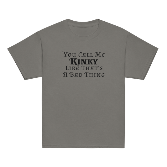 "You Call Me Kinky Like That's A Bad Thing" printed on a charcoal youth classic tee laying on a flat surface