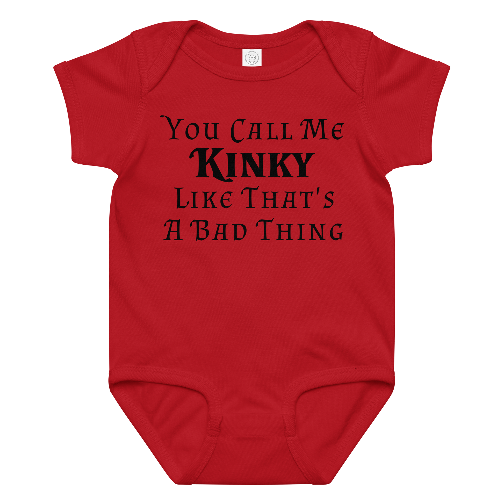 "You Call Me Kinky Like That's A Bad Thing" printed on a red baby jersey bodysuit laying on a flat surface amongst other clothes