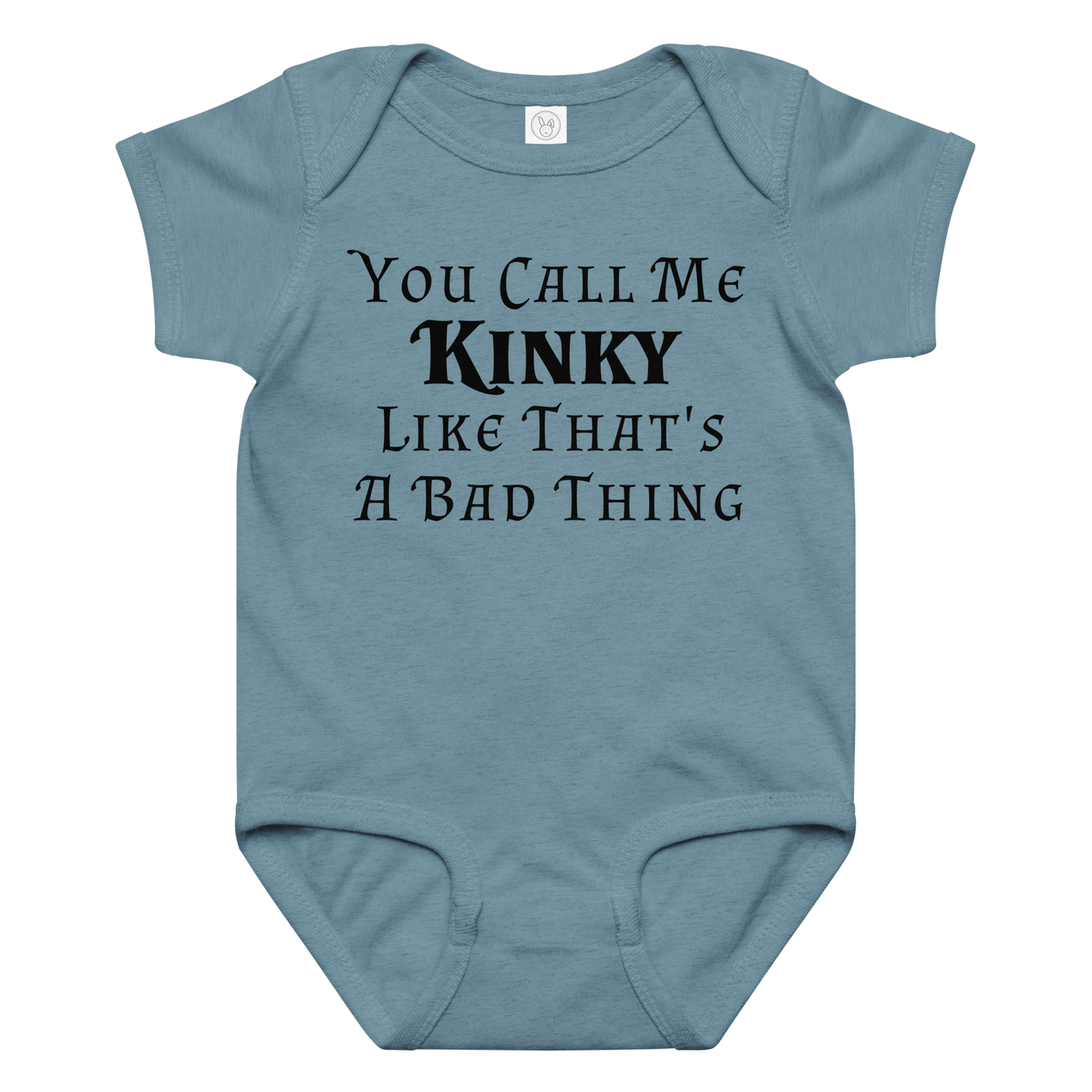 "You Call Me Kinky Like That's A Bad Thing" printed on a vintage indigo baby jersey bodysuit laying on a flat surface amongst other clothes