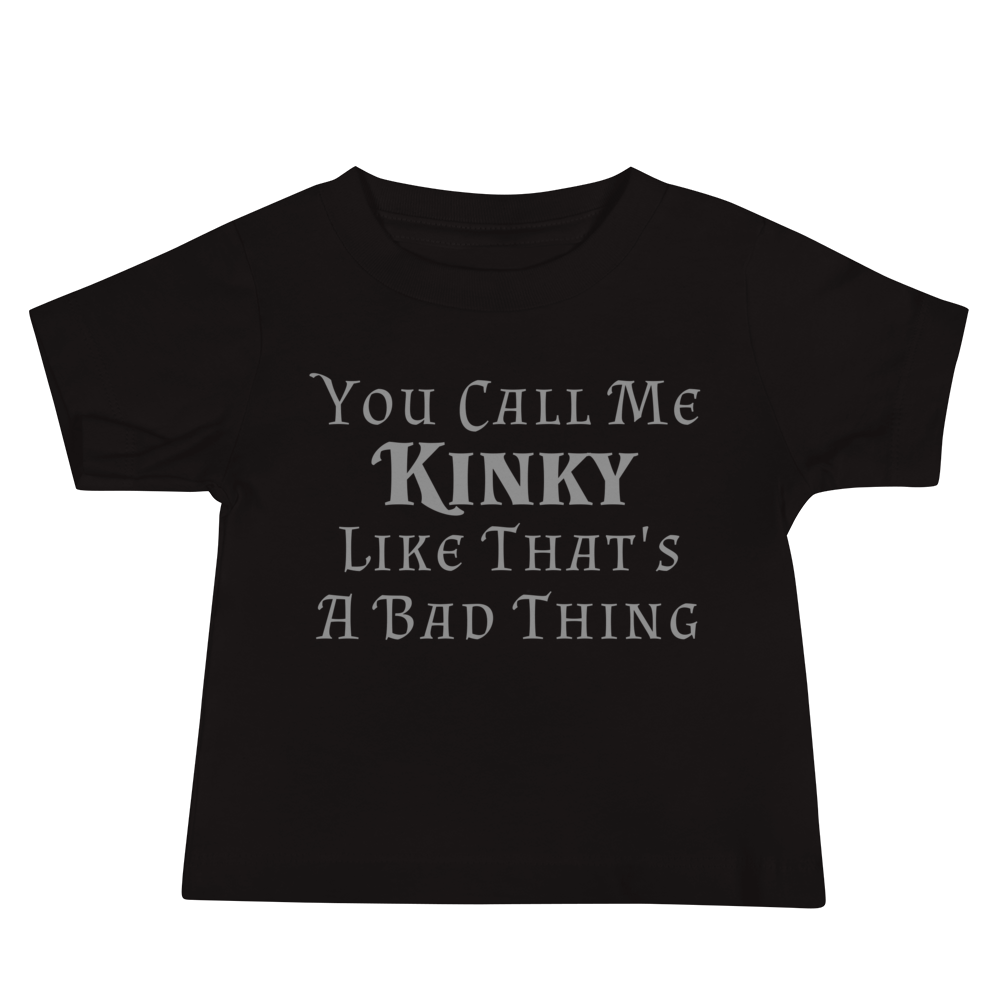 "You Call Me Kinky Like That's A Bad Thing" printed on a black baby jersey short sleeve tee laying on a flat surface
