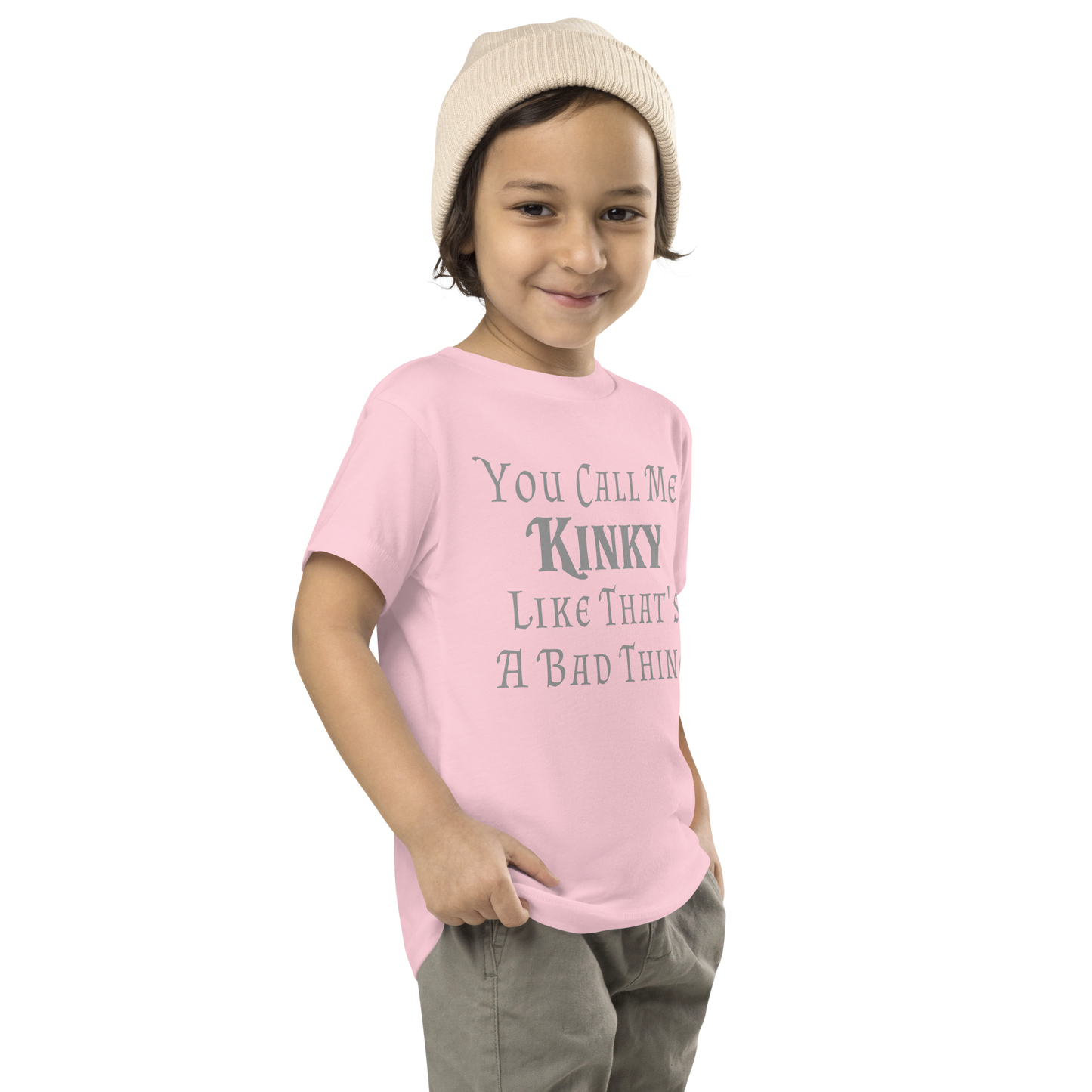 "You Call Me Kinky Like That's A Bad Thing" printed on a pink toddler short sleeve tee worn by a male who is also wearing a knit cap