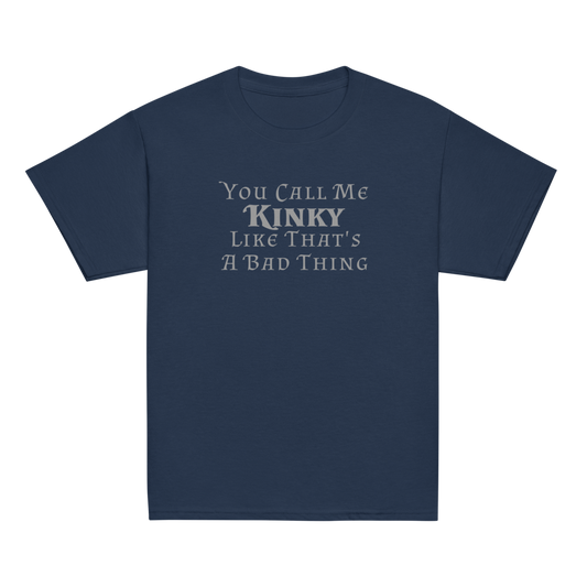 "You Call Me Kinky Like That's A Bad Thing" printed on a navy youth classic tee laying on a flat surface