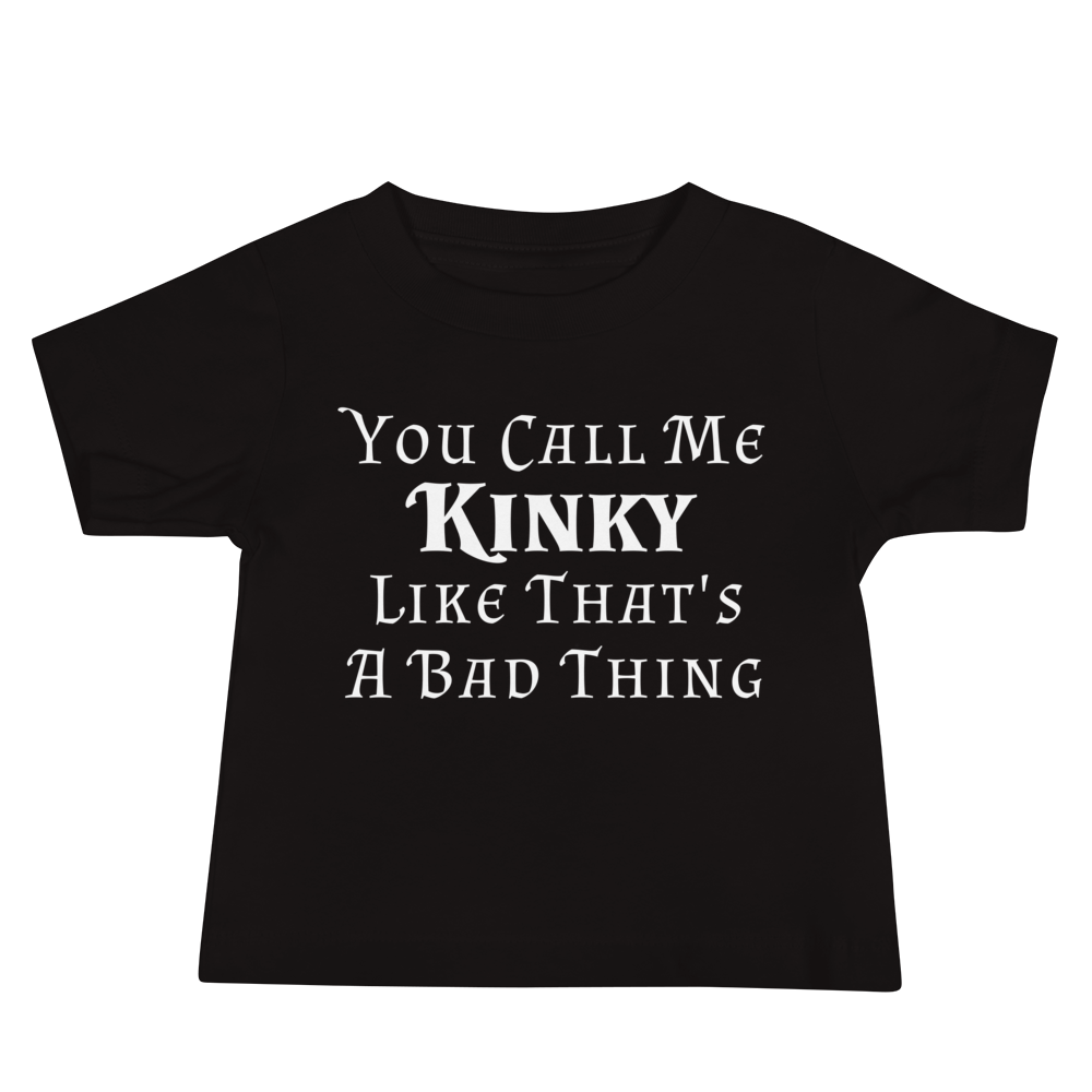 "You Call Me Kinky Like That's A Bad Thing" printed on a black baby jersey short sleeve tee laying on a flat surface