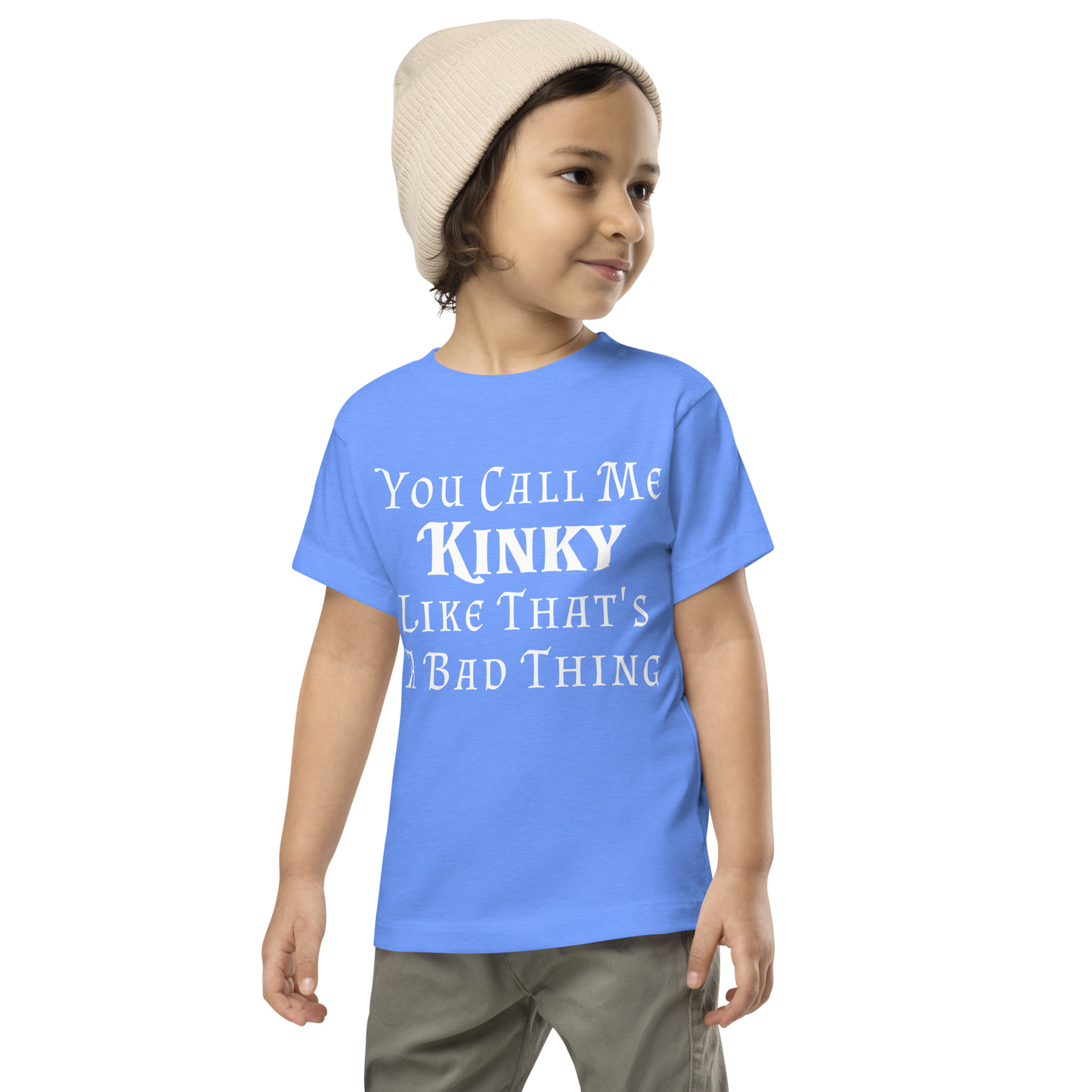"You Call Me Kinky Like That's A Bad Thing" printed on a heather columbia blue toddler short sleeve tee worn by a male wearing a cap