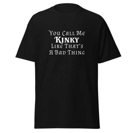 "You Call Me Kinky Like That's A Bad Thing" printed on a black unisex classic tee laying on a flat surface
