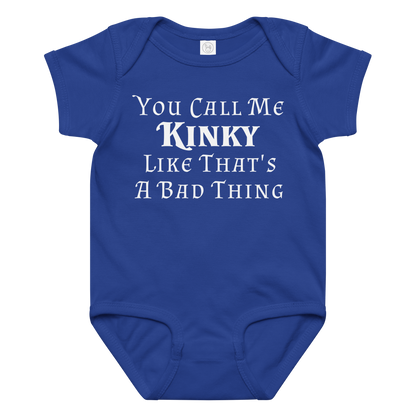 "You Call Me Kinky Like That's A Bad Thing" printed on a royal baby jersey bodysuit laying on a flat surface amongst other clothes