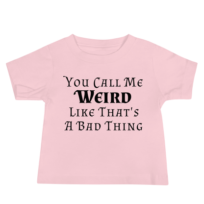 "You Call Me Weird Like That's A Bad Thing" printed on a pink baby jersey short sleeve tee laying on a flat surface