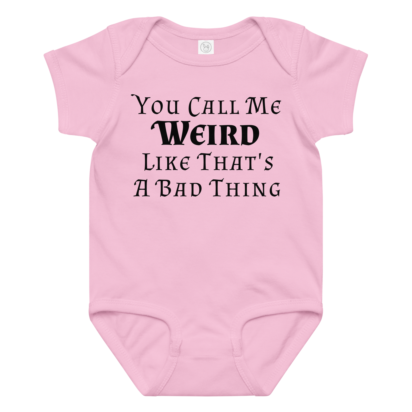 "You Call Me Weird Like That's A Bad Thing" printed on a pink baby jersey bodysuit laying on a flat surface amongst other clothes