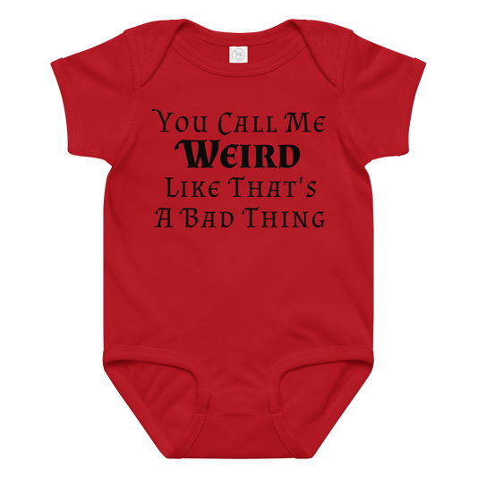 "You Call Me Weird Like That's A Bad Thing" printed on a red baby jersey bodysuit laying on a flat surface amongst other clothes