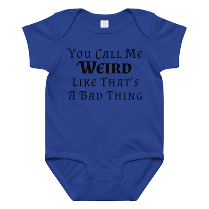 "You Call Me Weird Like That's A Bad Thing" printed on a royal baby jersey bodysuit laying on a flat surface amongst other clothes