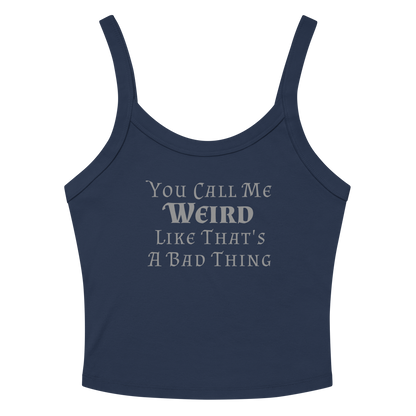 "You Call Me Weird Like That's A Bad Thing" printed on a solid navy blend women's micro-rib tanktop laying on a flat surface amongst sunglasses and shorts