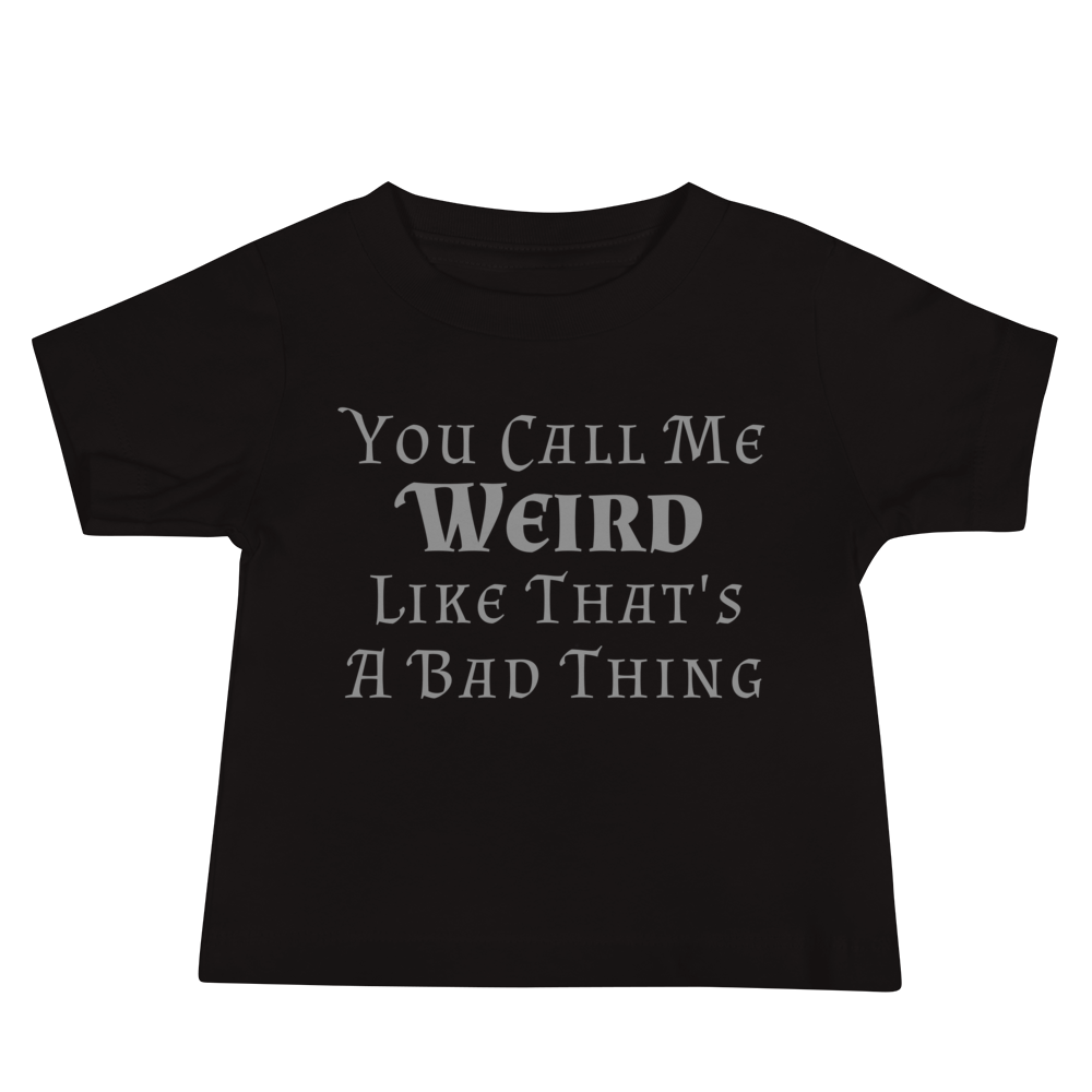 "You Call Me Weird Like That's A Bad Thing" printed on a black baby jersey short sleeve tee laying on a flat surface