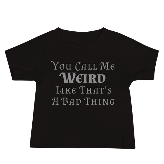 "You Call Me Weird Like That's A Bad Thing" printed on a black baby jersey short sleeve tee laying on a flat surface