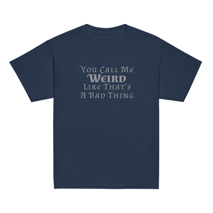 "You Call Me Weird Like That's A Bad Thing" printed on a navy youth classic tee laying on a flat surface