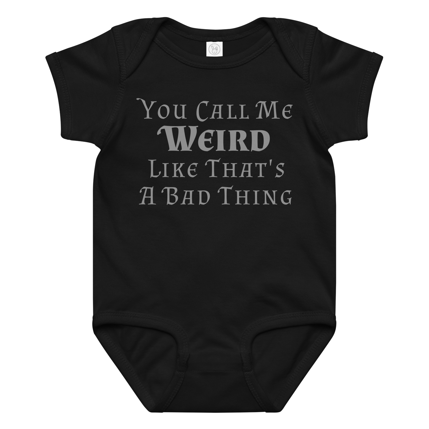 "You Call Me Weird Like That's A Bad Thing" printed on a black baby jersey bodysuit laying on a flat surface amongst other clothes