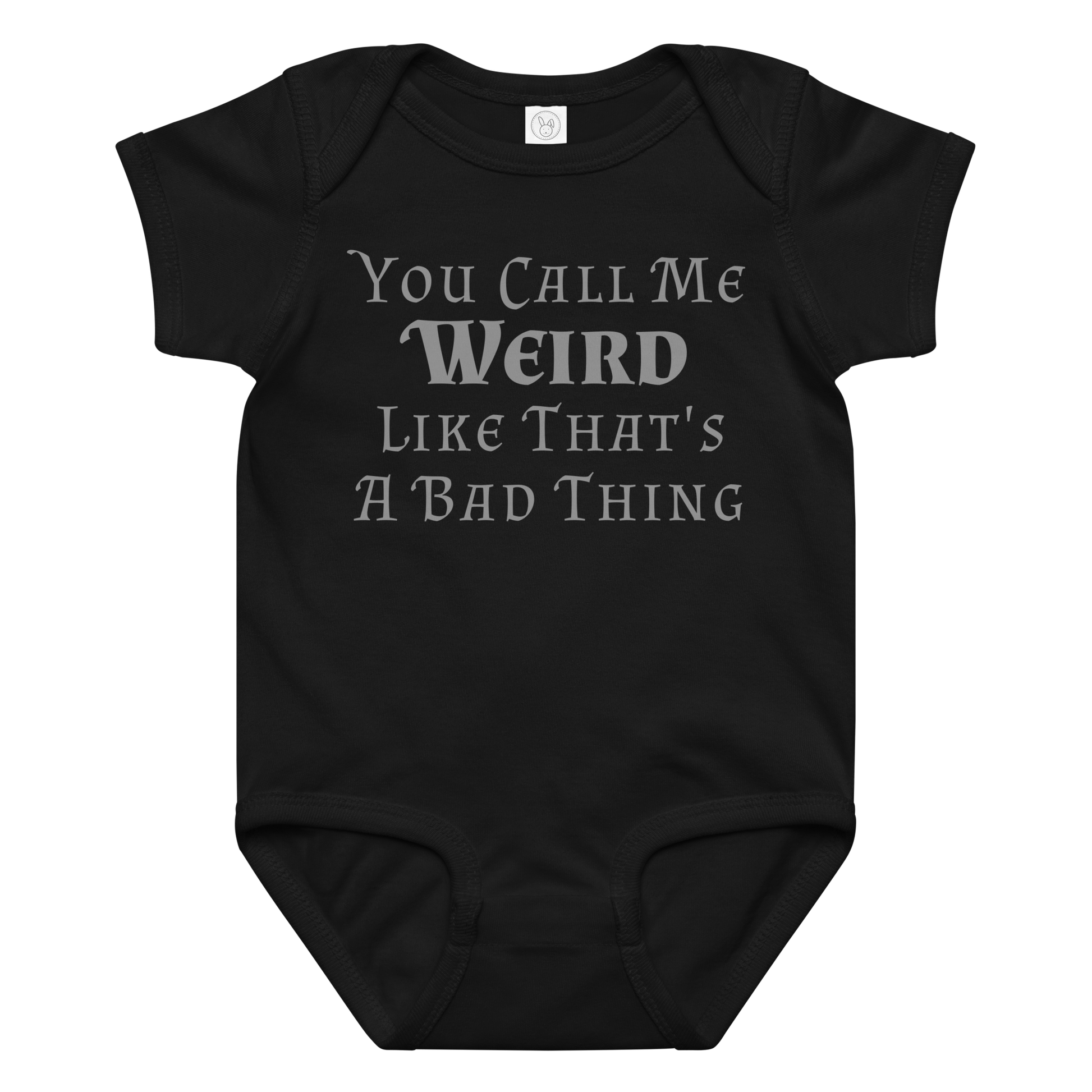 "You Call Me Weird Like That's A Bad Thing" printed on a black baby jersey bodysuit laying on a flat surface amongst other clothes