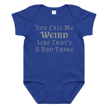 "You Call Me Weird Like That's A Bad Thing" printed on a royal baby jersey bodysuit laying on a flat surface amongst other clothes