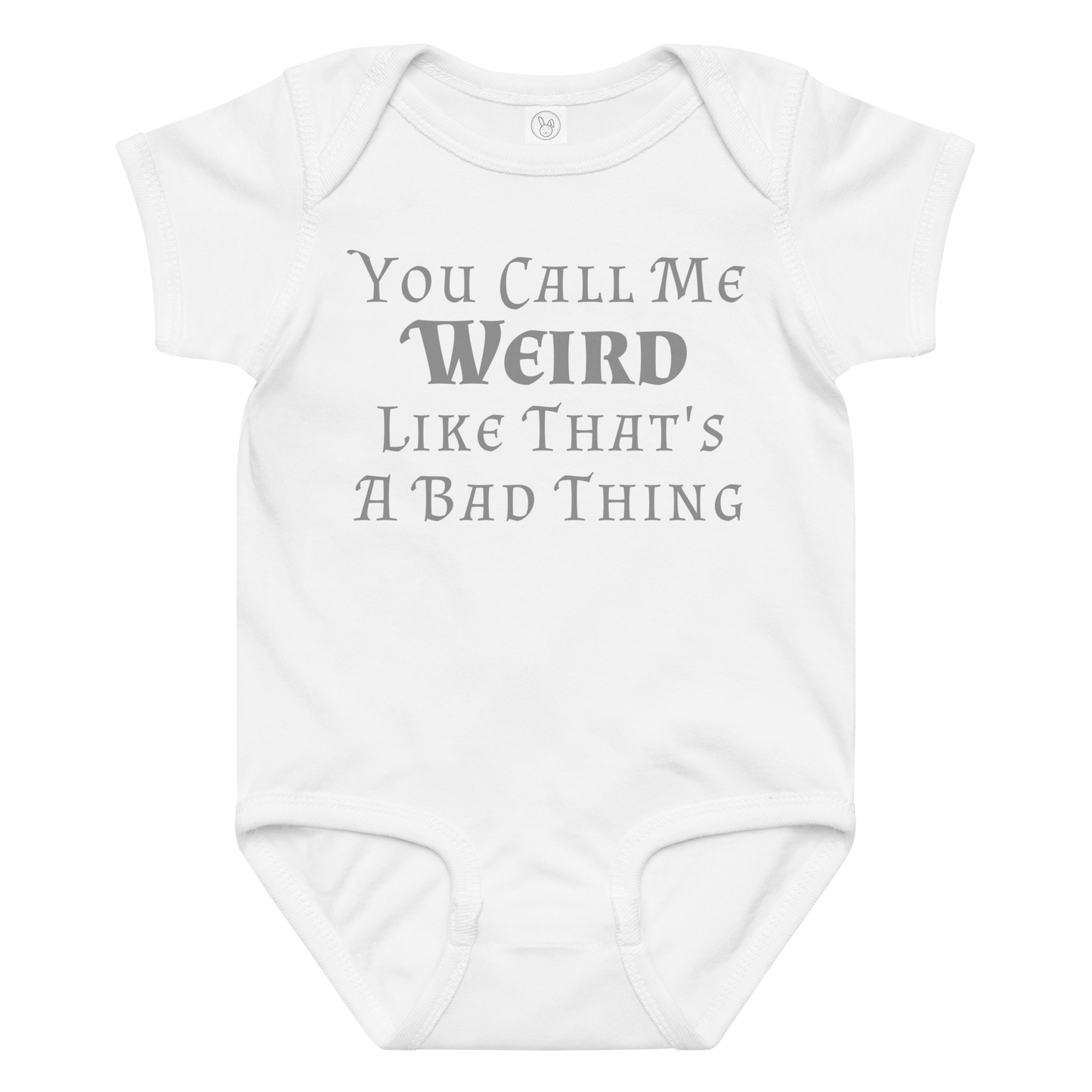 "You Call Me Weird Like That's A Bad Thing" printed on a white baby jersey bodysuit laying on a flat surface amongst other clothes