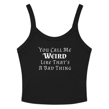 "You Call Me Weird Like That's A Bad Thing" printed on a solid black blend women's micro-rib tanktop laying on a flat surface amongst sunglasses and shorts
