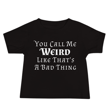 "You Call Me Weird Like That's A Bad Thing" printed on a black baby jersey short sleeve tee laying on a flat surface