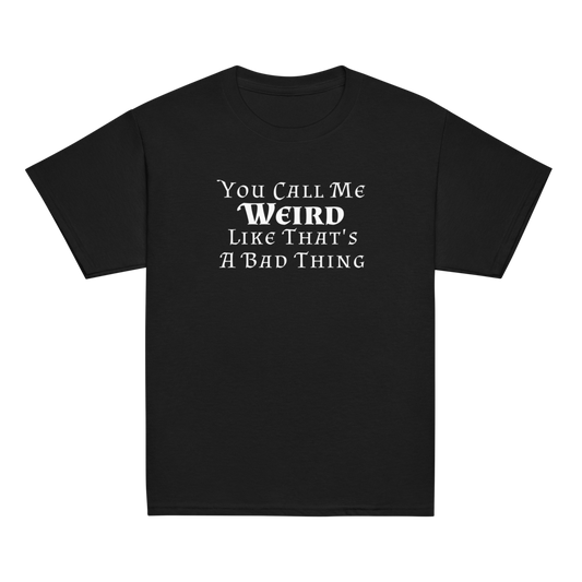 "You Call Me Weird Like That's A Bad Thing" printed on a black youth classic tee laying on a flat surface