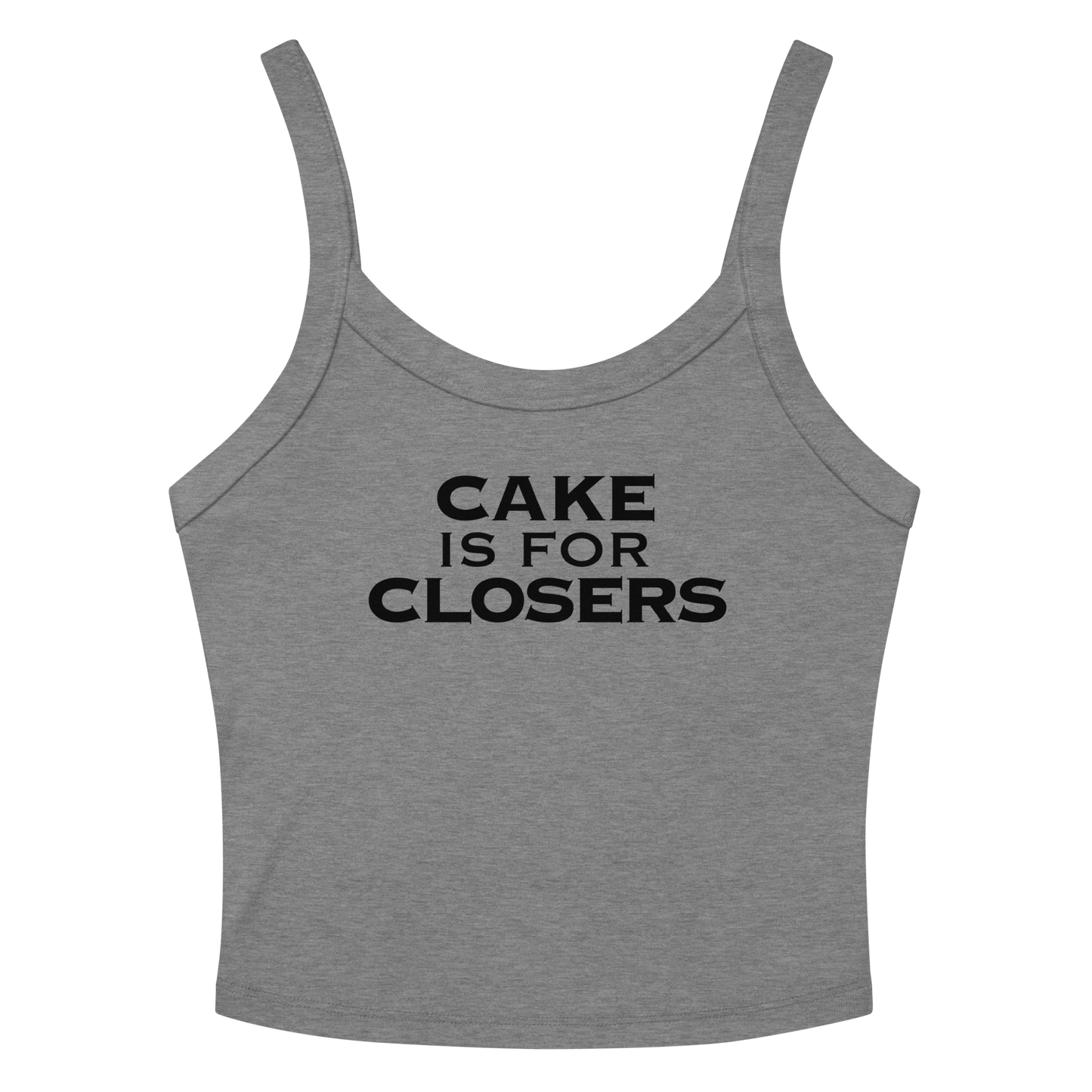 "Cake Is For Closers" printed on a athletic heather women's micro-rib tanktop laying on a flat surface amongst sunglasses and shorts