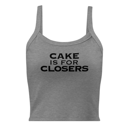 "Cake Is For Closers" printed on a athletic heather women's micro-rib tanktop laying on a flat surface