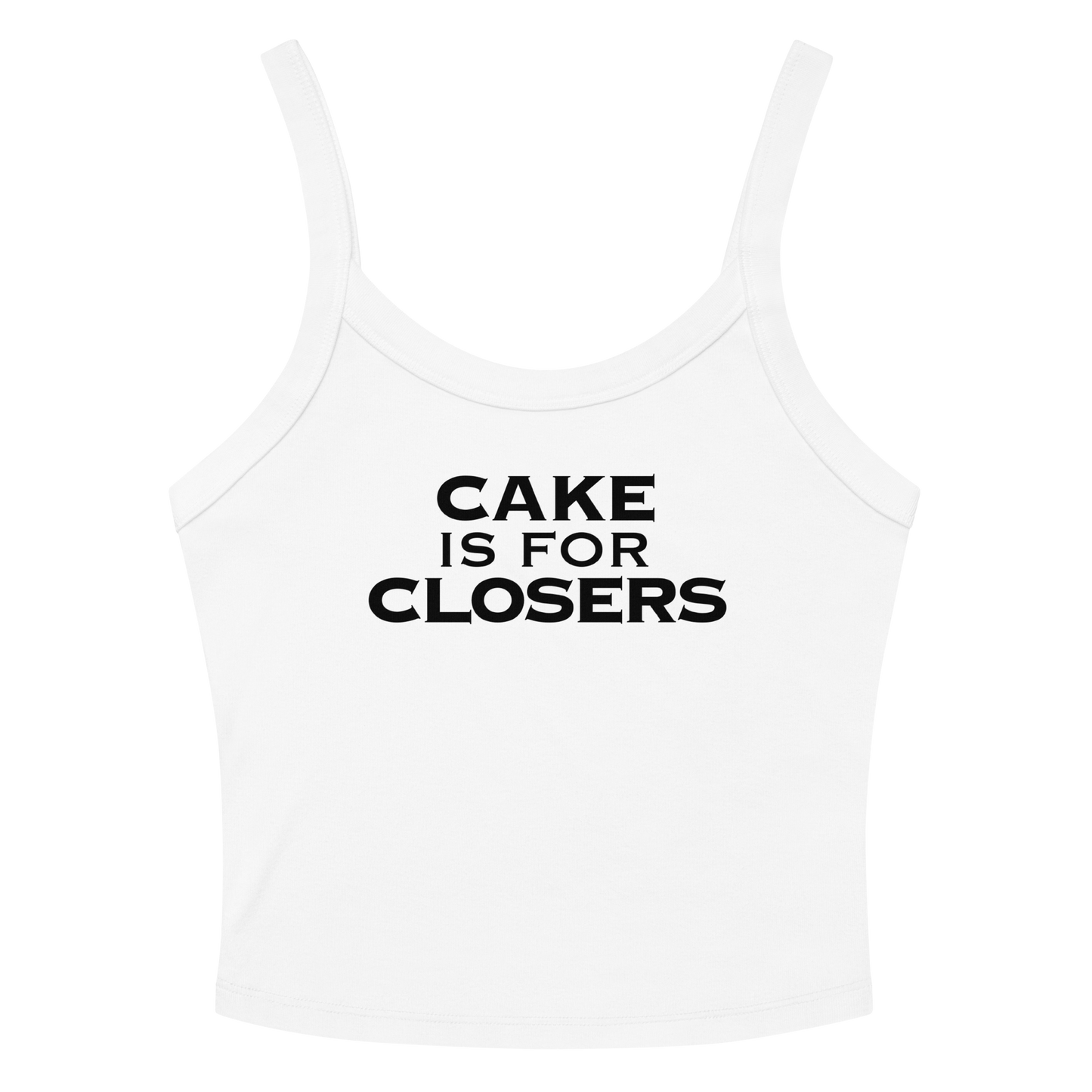 "Cake Is For Closers" printed on a solid white blend women's micro-rib tanktop laying on a flat surface amongst sunglasses and shorts