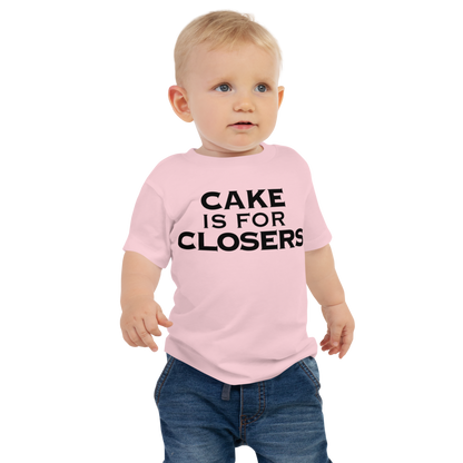 "Cake Is For Closers" printed on a pink baby jersey short sleeve tee worn by a male