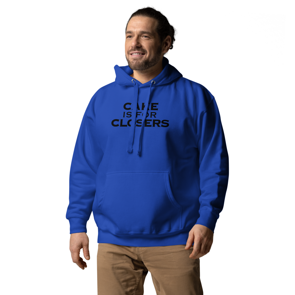 "Cake Is For Closers" printed on a team royal unisex hoodie worn by a male