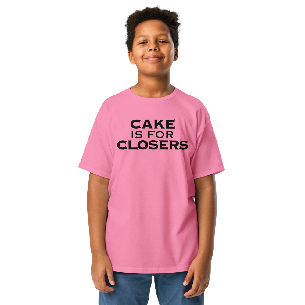 "Cake Is For Closers" printed on a azalea youth classic tee worn by a male