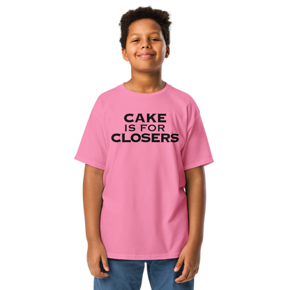 "Cake Is For Closers" printed on a azalea youth classic tee worn by a male