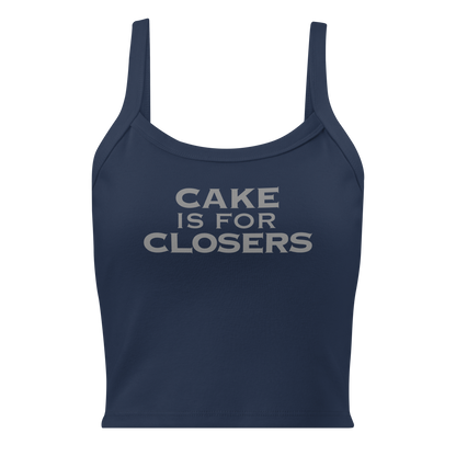 "Cake Is For Closers" printed on a solid navy blend women's micro-rib tanktop laying on a flat surface