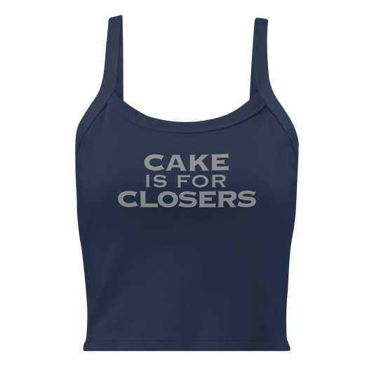 "Cake Is For Closers" printed on a solid navy blend women's micro-rib tanktop laying on a flat surface