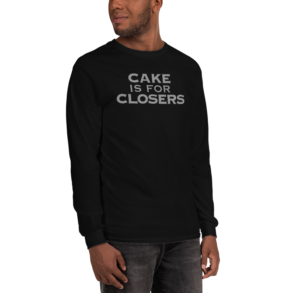 "Cake Is For Closers" printed on a black men's long sleeve shirt worn by a male
