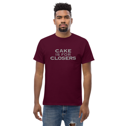 "Cake Is For Closers" printed on a maroon unisex classic tee worn by a male