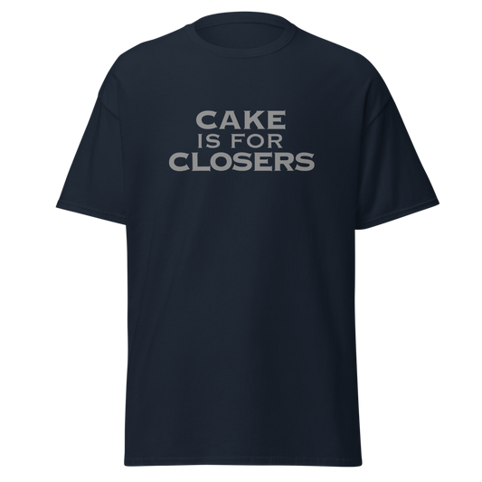 "Cake Is For Closers" printed on a navy unisex classic tee laying on a flat surface