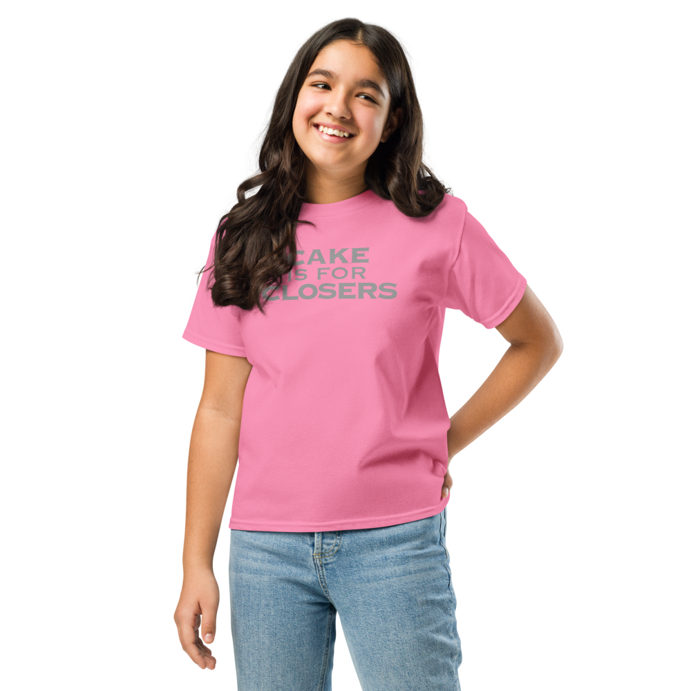 "Cake Is For Closers" printed on a azalea youth classic tee worn by a female