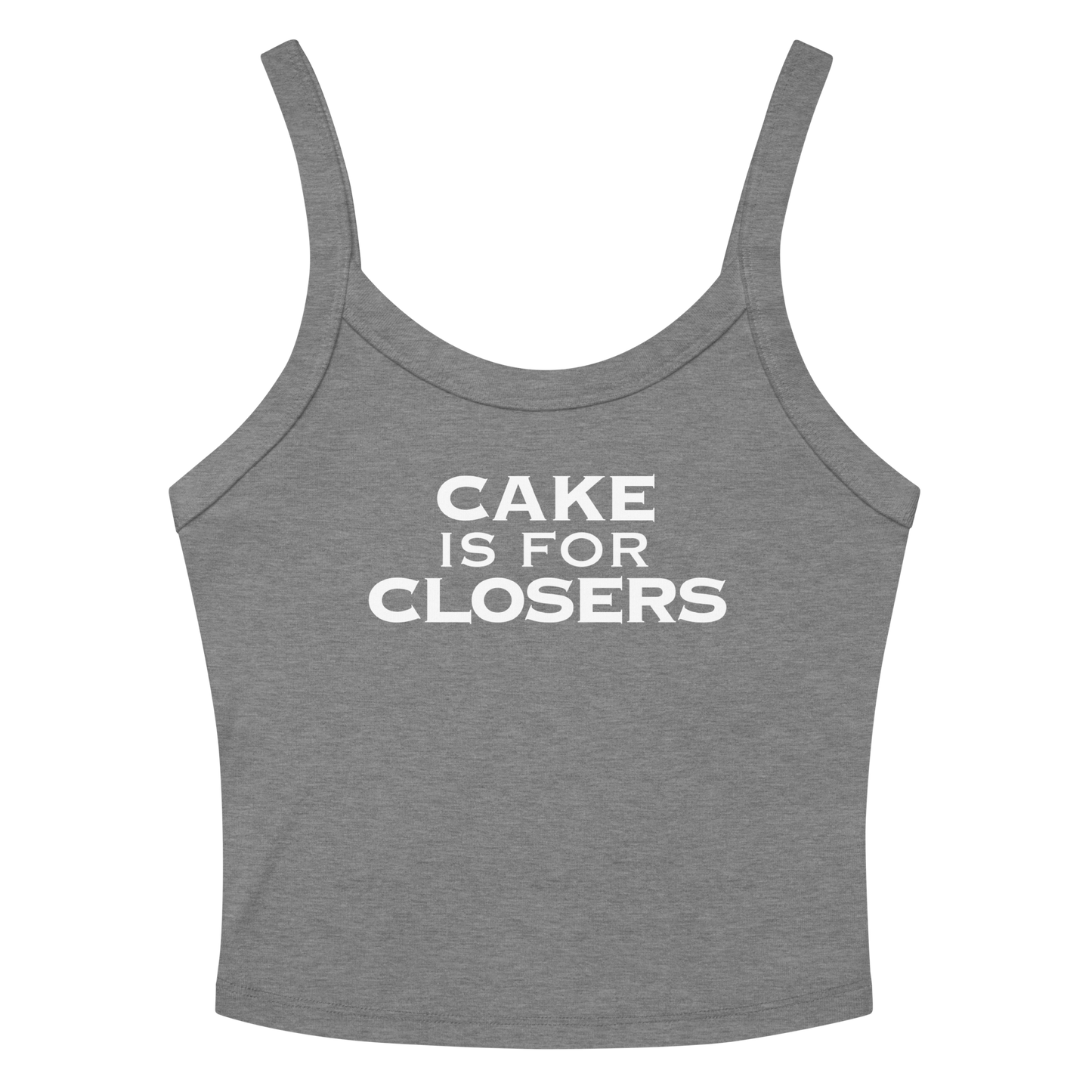 "Cake Is For Closers" printed on a athletic heather women's micro-rib tanktop laying on a flat surface amongst sunglasses and shorts