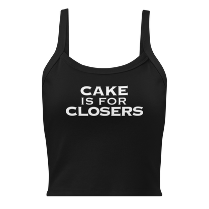 "Cake Is For Closers" printed on a solid black blend women's micro-rib tanktop laying on a flat surface