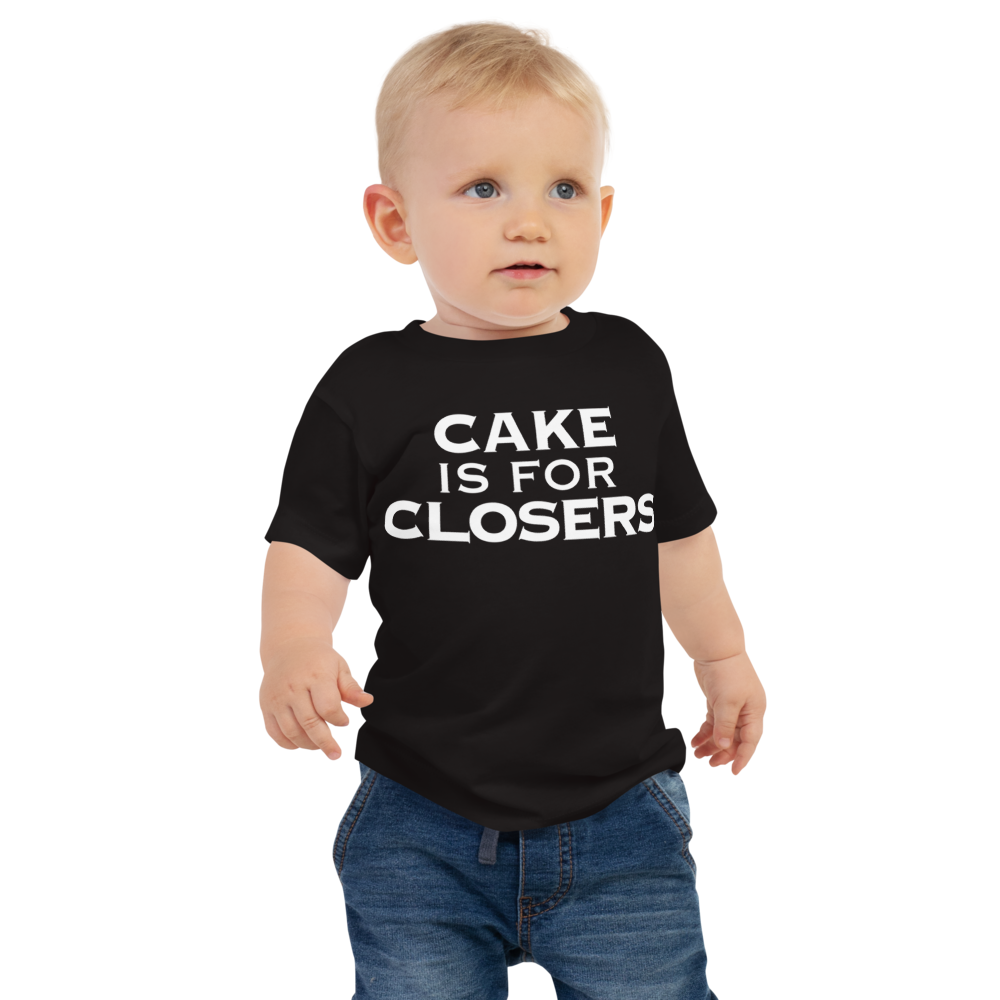 "Cake Is For Closers" printed on a black baby jersey short sleeve tee worn by a male