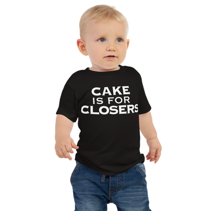 "Cake Is For Closers" printed on a black baby jersey short sleeve tee worn by a male